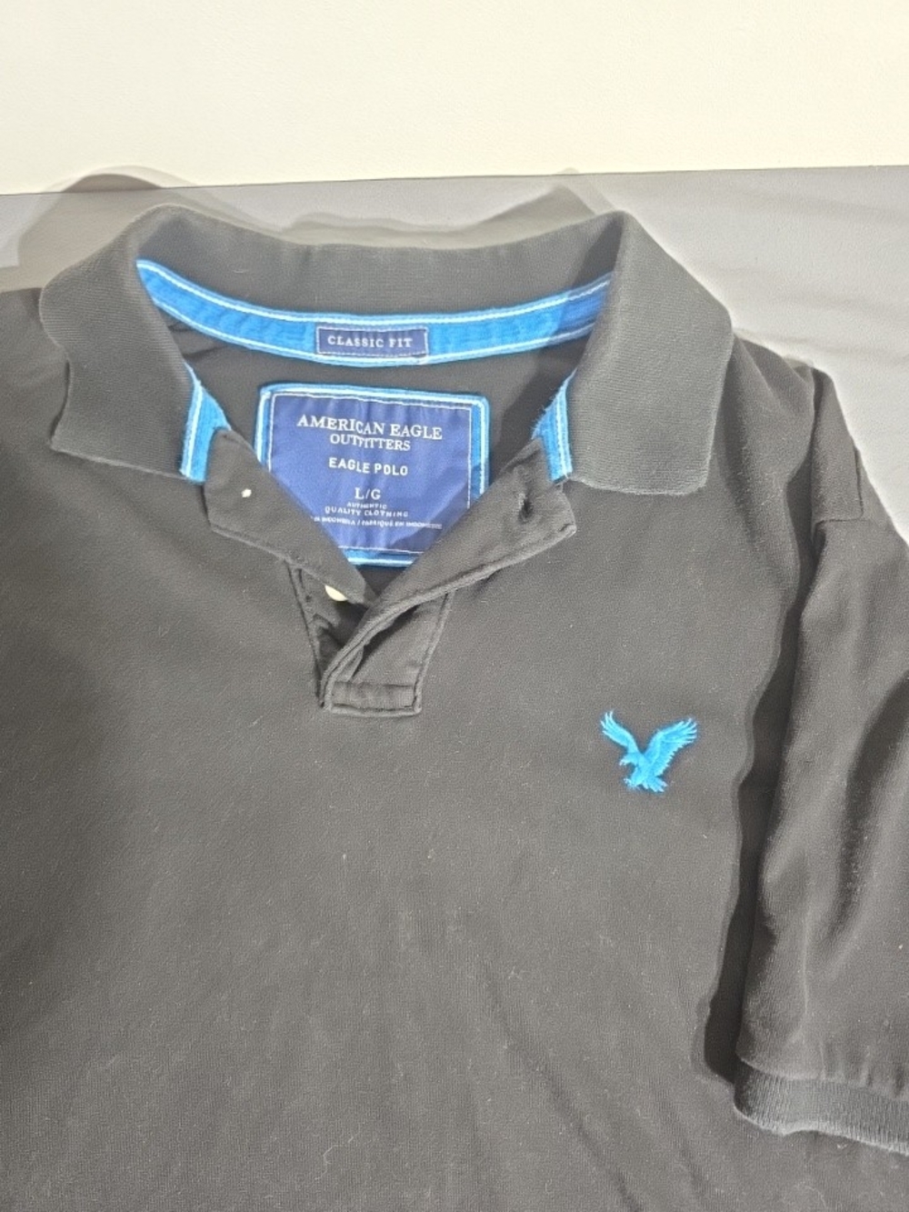American Eagle Outfitters Men’s Black Polo with Blue Logo